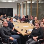 Modern office conference room with professionals working together.