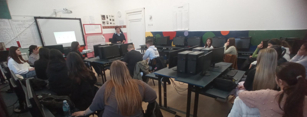 High school visit with students and teacher during educational tour.