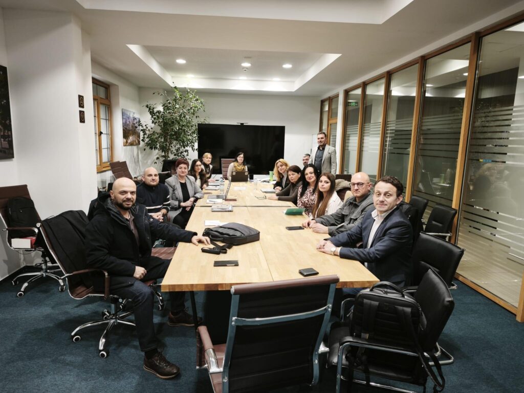 Team meeting in modern conference room at Impetus office for business growth.