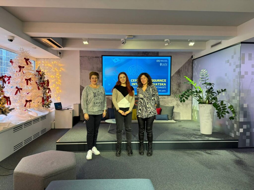 Three women standing on stage during Safer Internet practices exchange event.