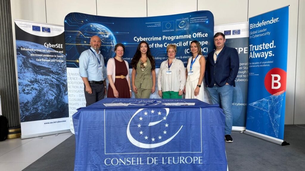 Group photo at CyberSea Festival 2026 with European Cybersecurity banners.